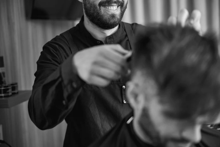 close-up-of-bearded-hair-stylist-working-with-plea-2021-09-03-14-36-31-utc-modified-min